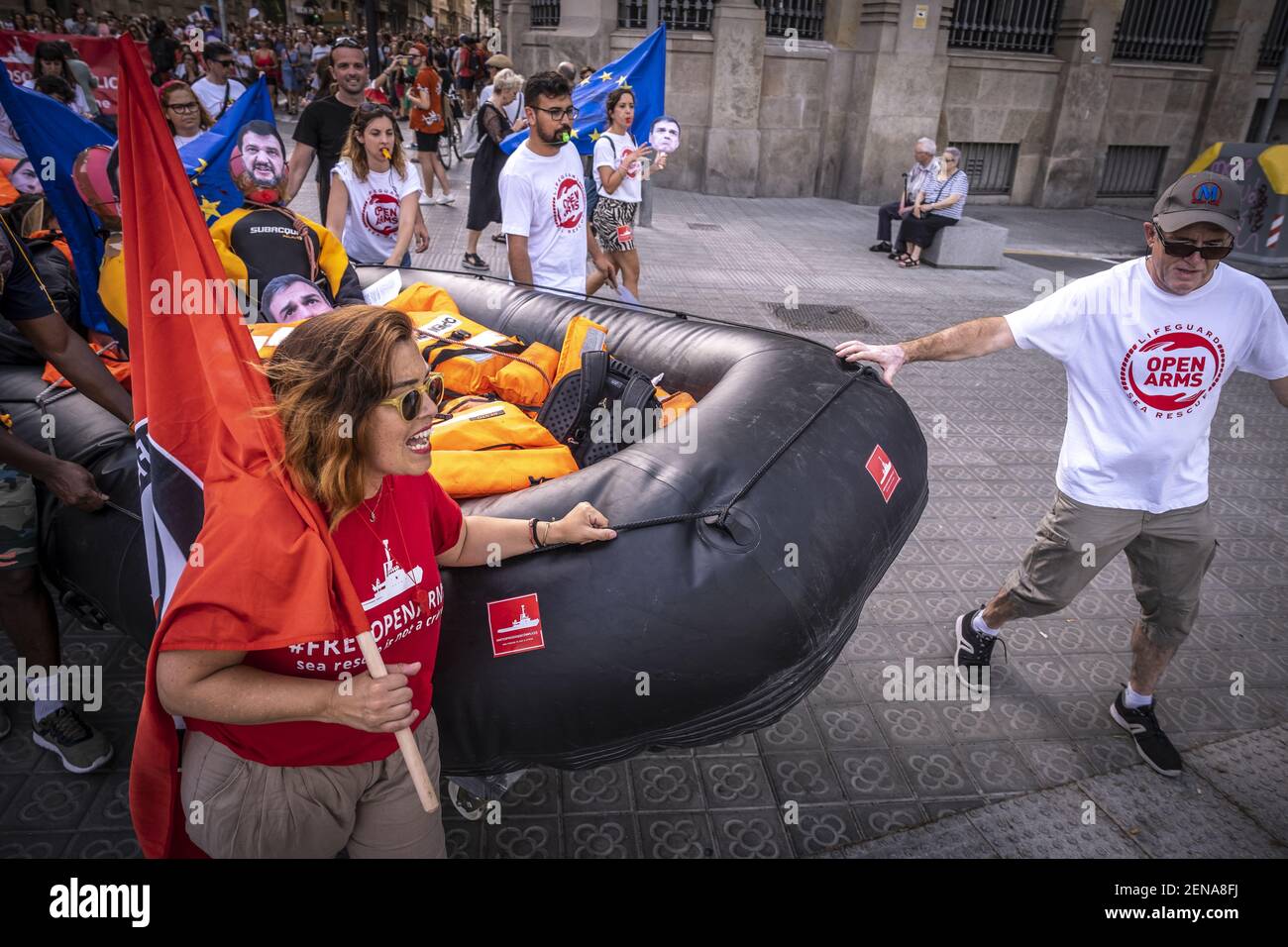 Protester drag a rescue raft during the demonstration. Some 500 people ...