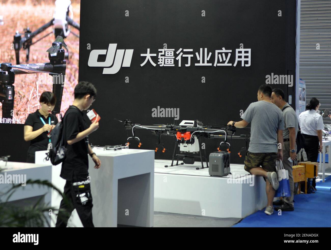 FILE--Customers shop at a store of DJI Technology Co. in Shenzhen city,  south China's Guangdong province, 21 June 2019. The US government has  granted clearance for Chinese drone manufacturer DJI's high-security  "Government