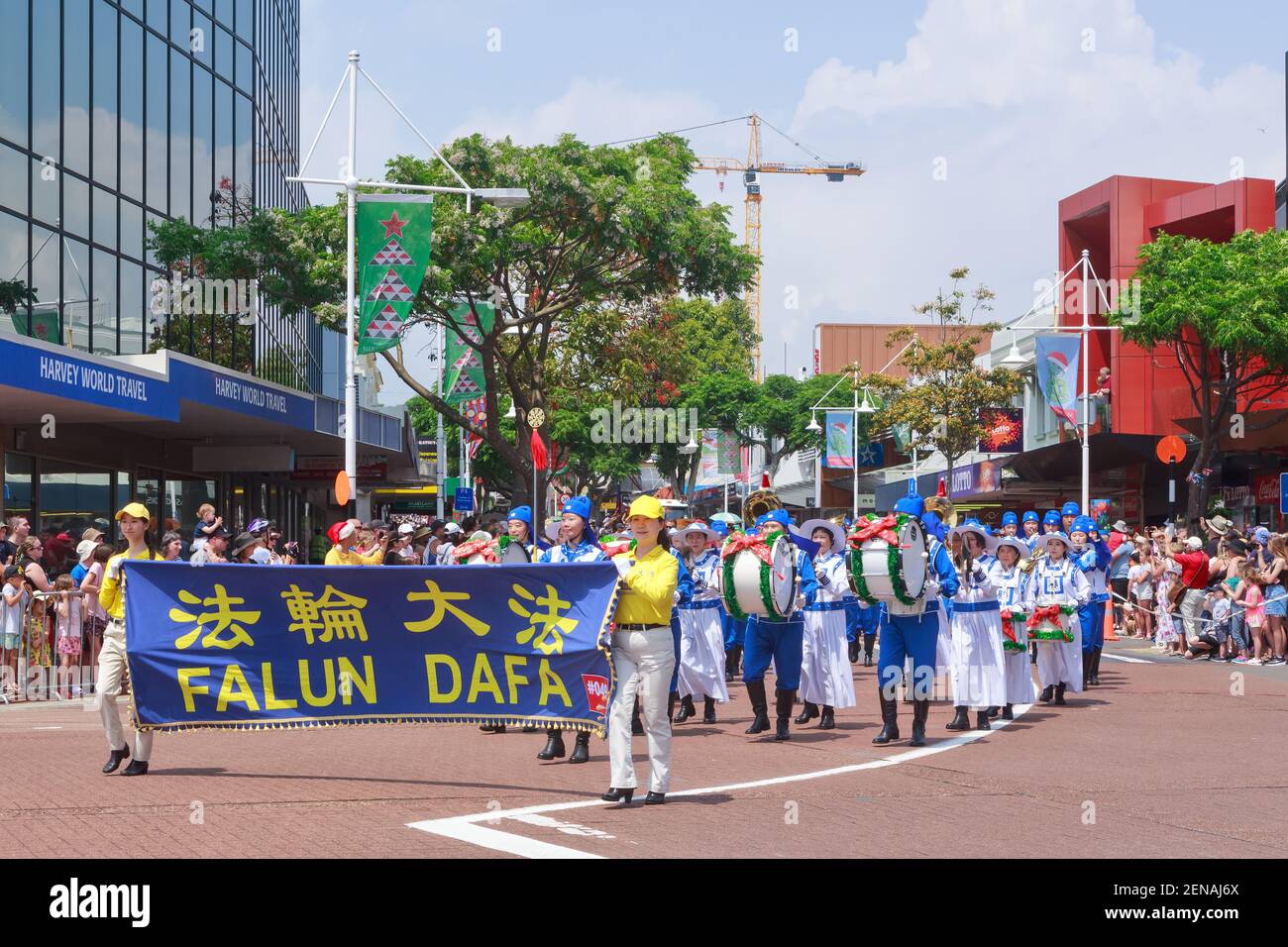 Members of Falun Dafa (Falun Gong), a Chinese religion, marching in a Christmas parade. Tauranga, New Zealand Stock Photo