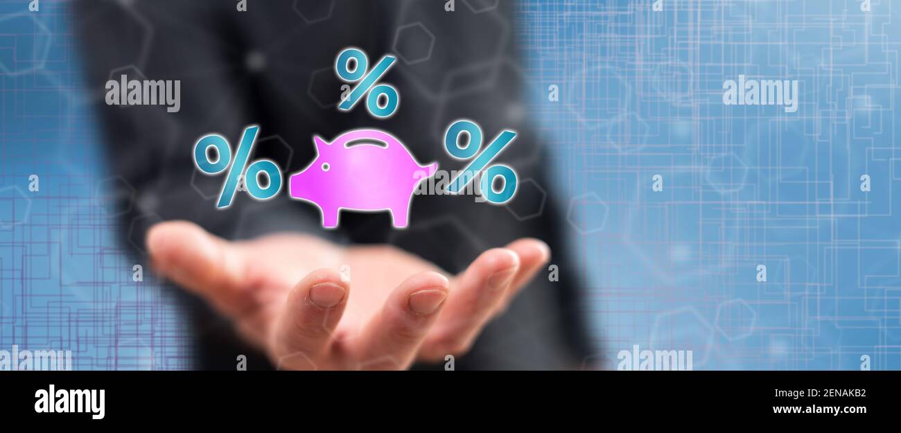 Interest rates concept above the hand of a man in background Stock ...