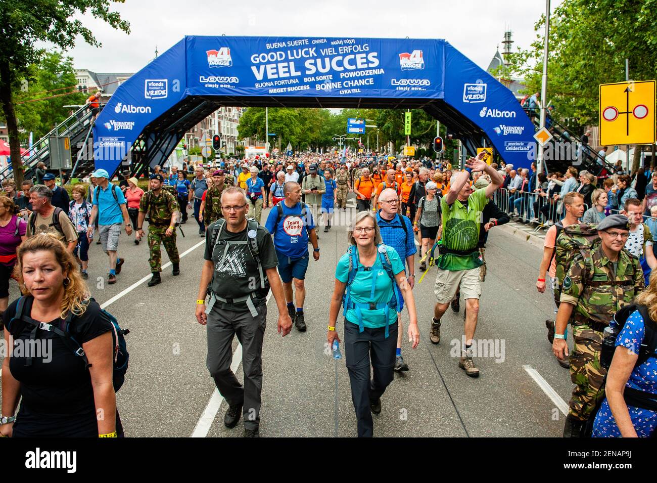 Participants cross the finish line during the first day. Since it is the  world's biggest multi-day walking event, the Four Days March is seen as the  prime example of sportsmanship and international