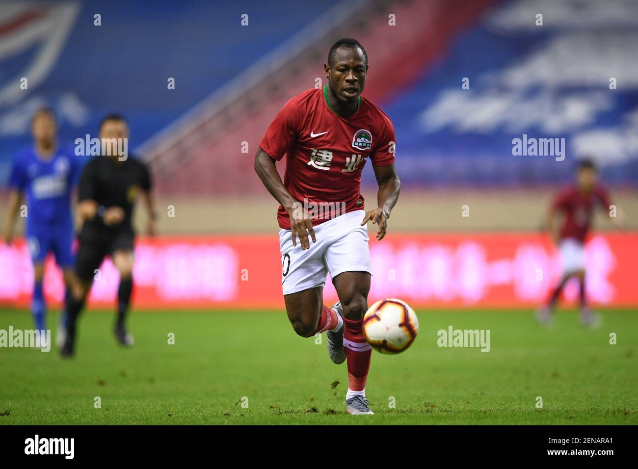 Cameroonian football player Christian Bassogog of Henan Jianye F.C. keeps the ball during the 18th round of Chinese Football Association Super League (CSL) against Shanghai Greenland Shenhua in Shanghai, China, 16 July 2019. (Photo by Stringer - Imaginechina/Sipa USA) Stock Photo