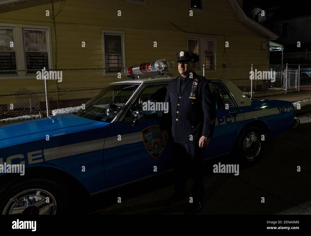 New York, United States. 26th Feb, 2021. Detective Caputo stands next to  police car Chevrolet Caprice similar that was used by Edward Byrne seen at  annual vigil for police officer Edward Byrne