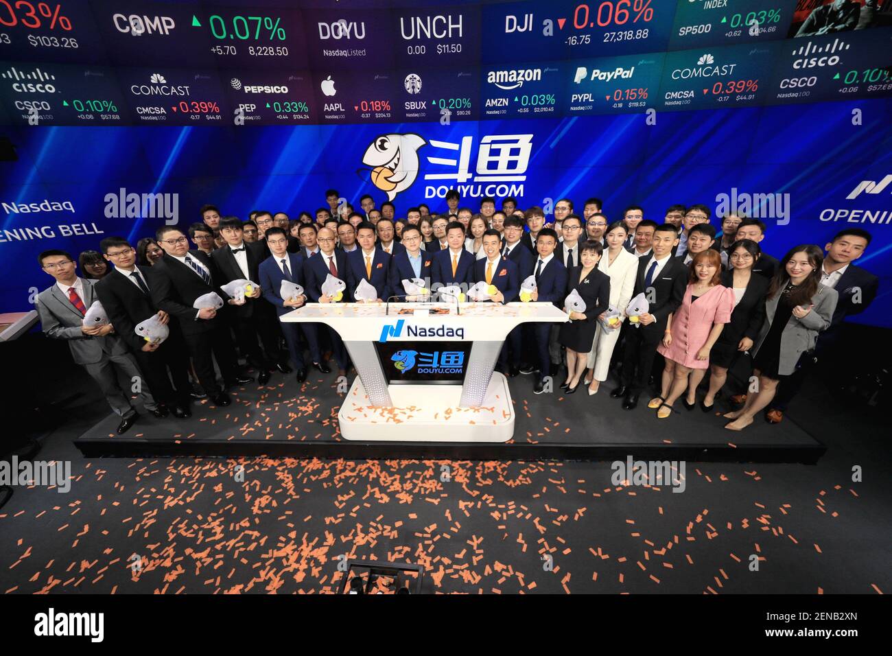 In this handout image, Chen Shaojie, center left, and Zhang Wenming, center right, co-founders and CEO of DouYu International Holdings Limited, pose on the Nasdaq stock exchange in Times Square as DouYu