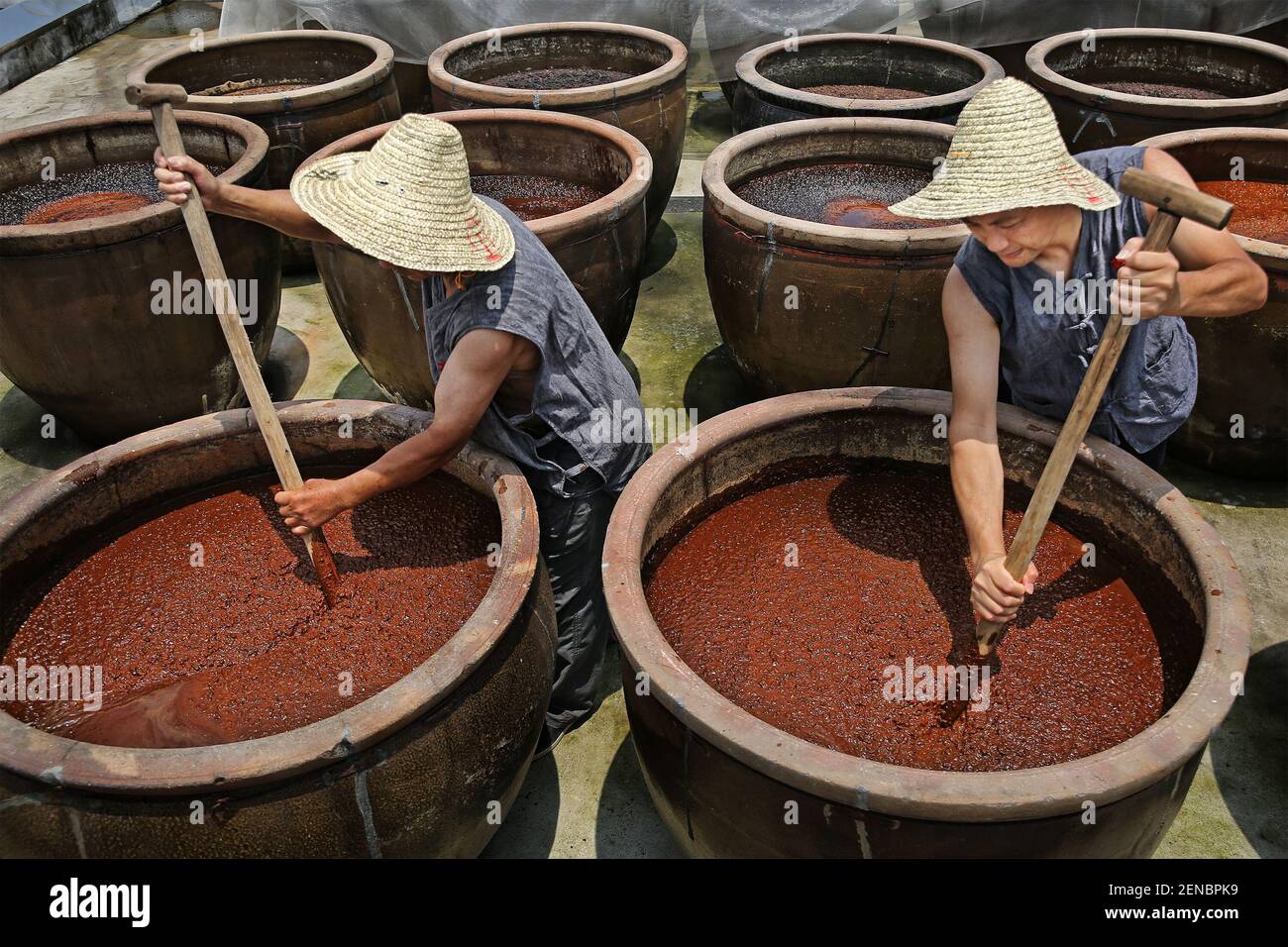 Chinese artisan Chen Xudong stirs the 