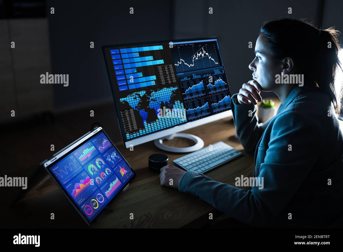 Business Woman Analyst Using KPI Data On Computer Stock Photo