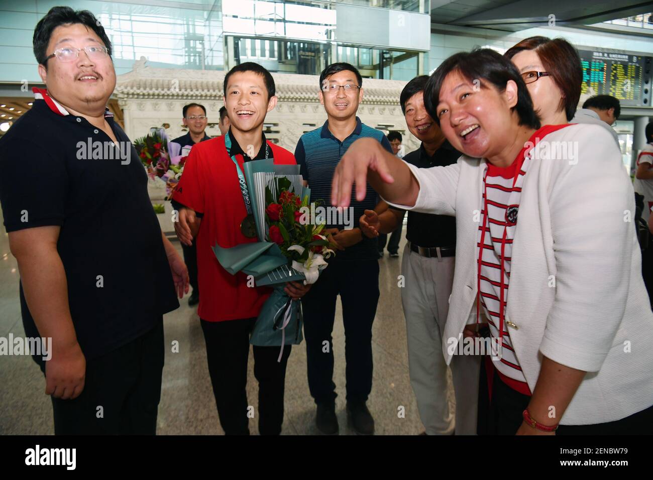 A high-school student from team China arrives at the Beijing Capital ...