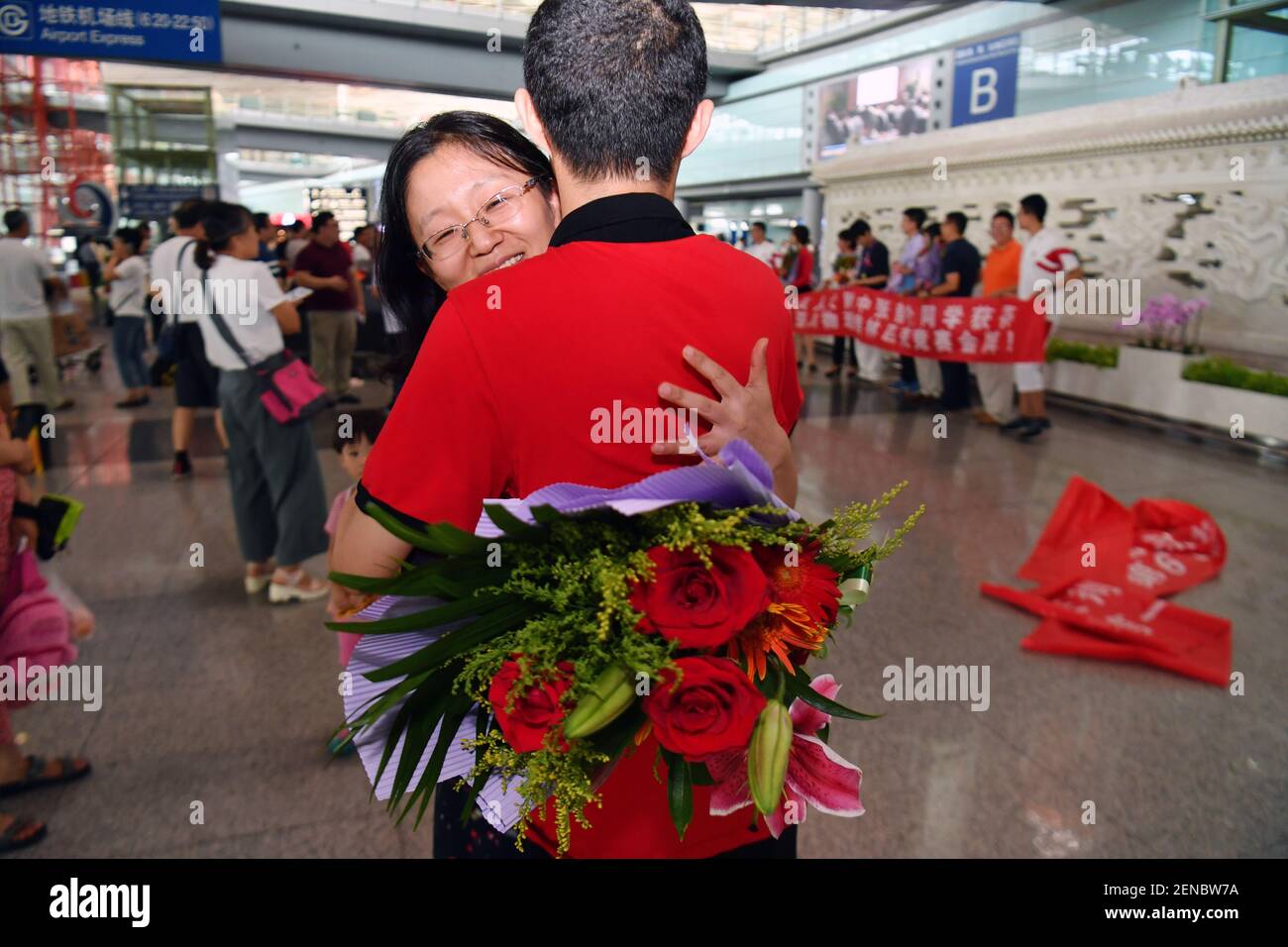 A high-school student from team China arrives at the Beijing Capital ...