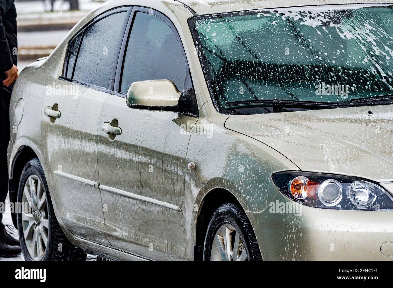 car wash with water and foam cleaning. auto, service vehicle industry