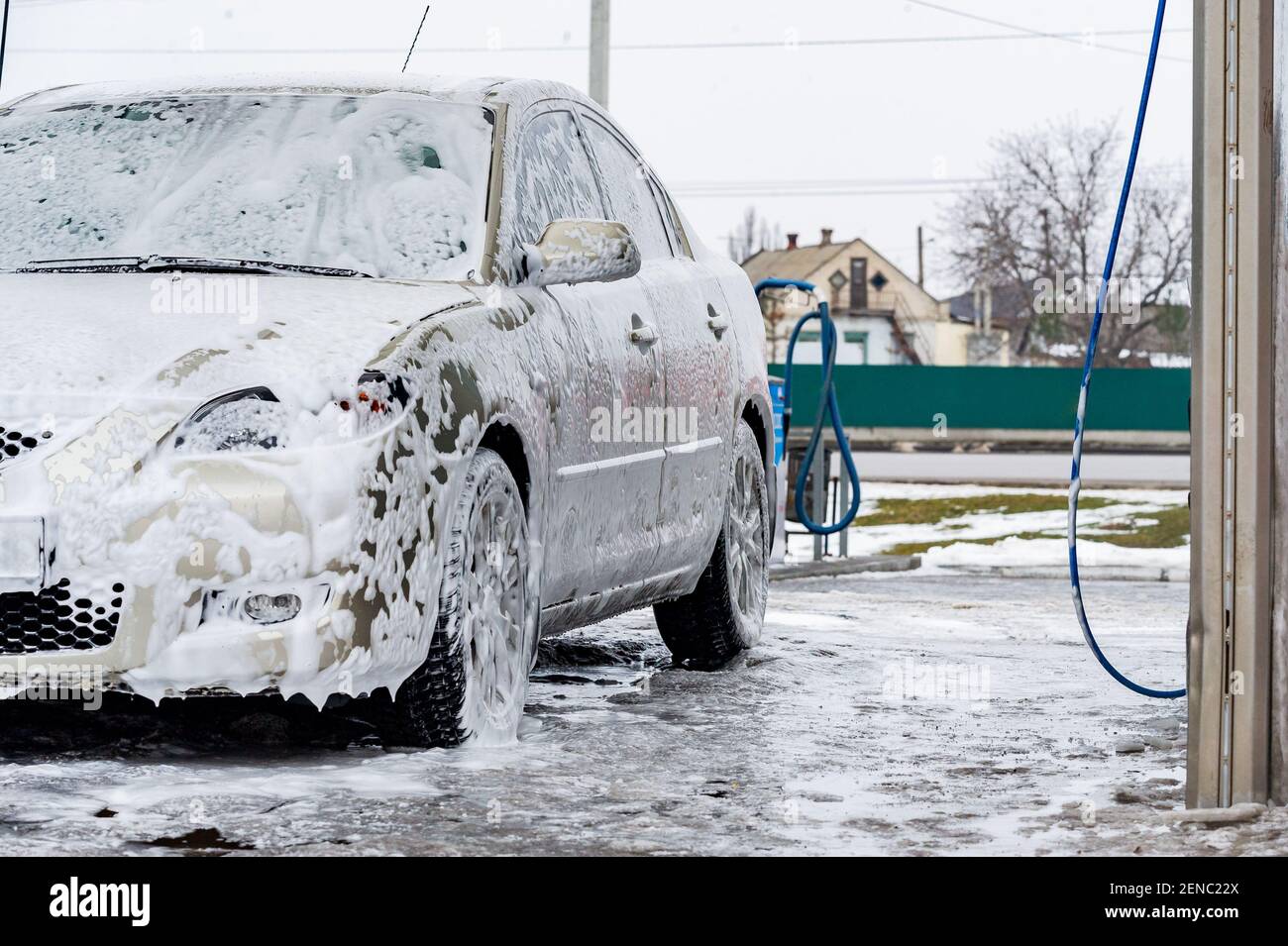 car wash with water and foam cleaning. auto, service vehicle industry