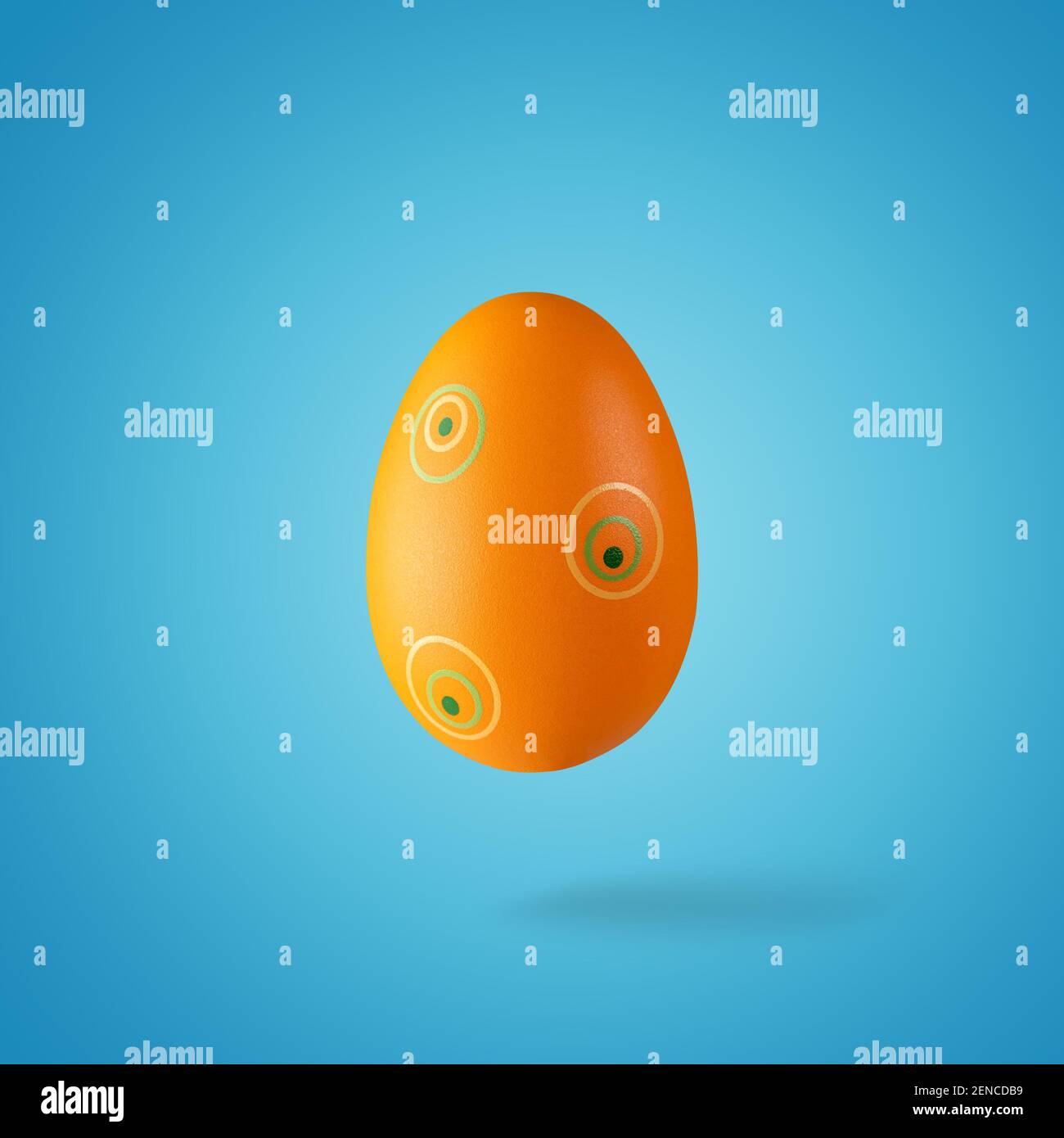 Creative composition made of orange Easter egg. Minimal spring or summer Holiday concept. Fun background. Stock Photo