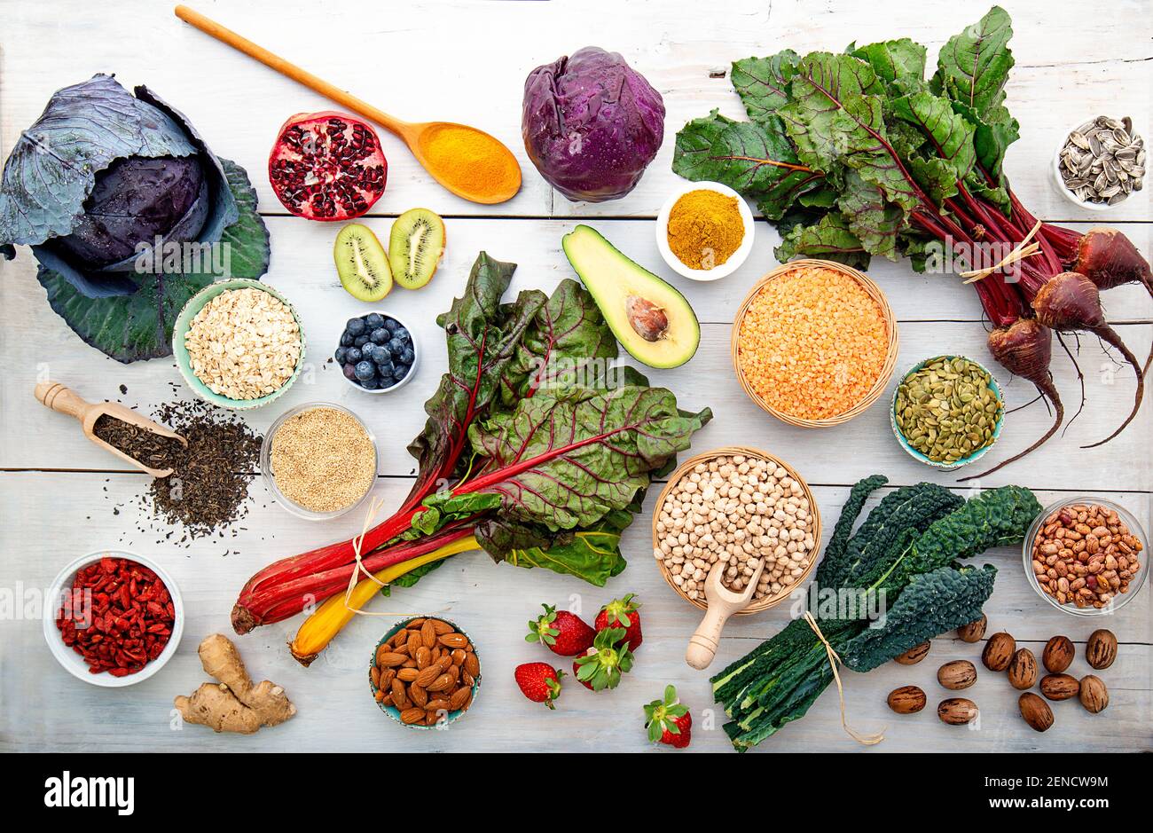 white wooden board with red vegetables cabbage turnips superfood Stock