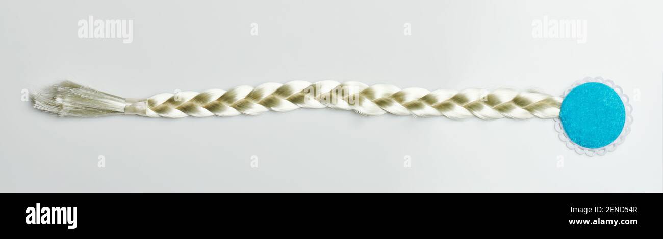 Long straight white hair braid isolated on studio background Stock Photo