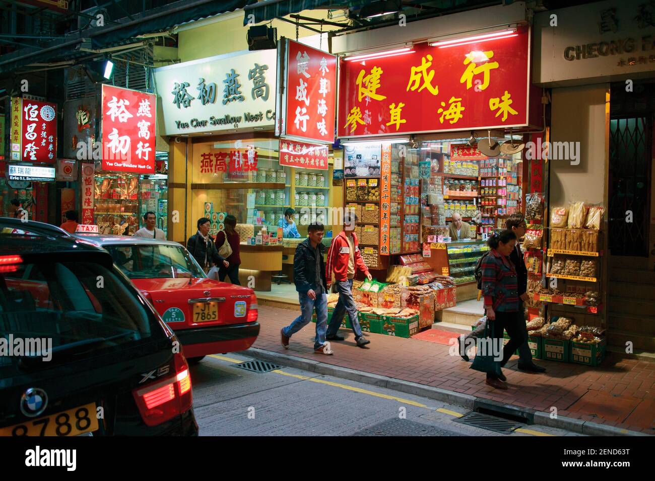 Hong Kong, China. Night shopping scene in Wing Lok Street, Sheung Wan. Traditional shops. Stock Photo
