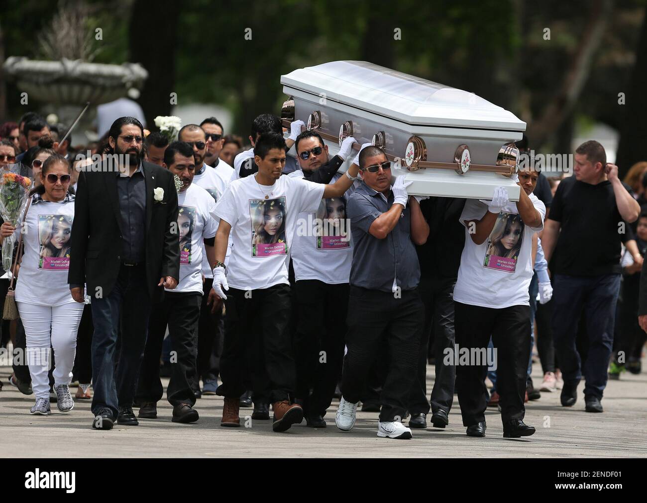 Family and friends carry the casket of Marlen OchoaLopez during her funeral service at Mount