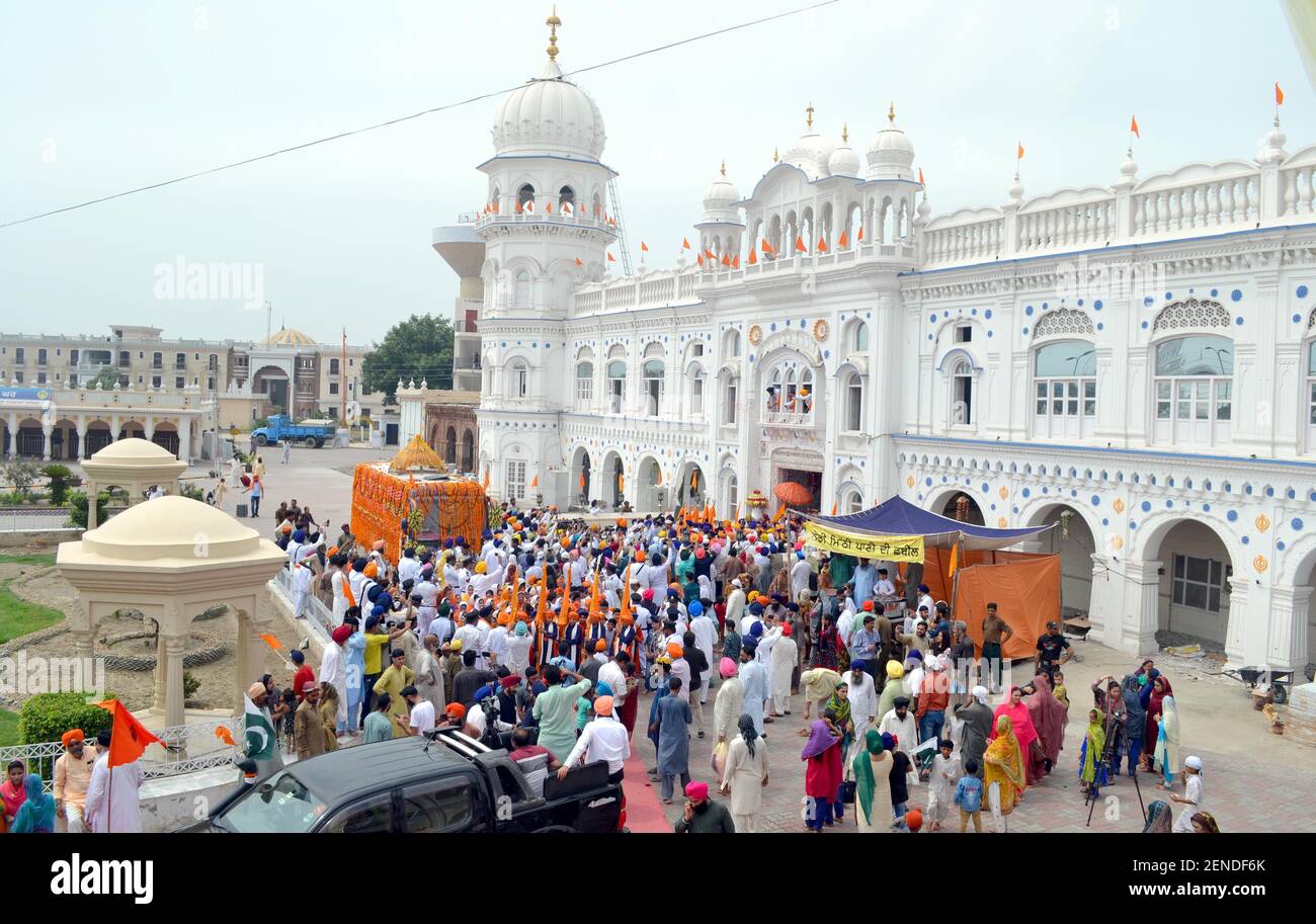 NANKANA SAHIB, PAKISTAN AUGUST 1 Devotees hold swords and flags as