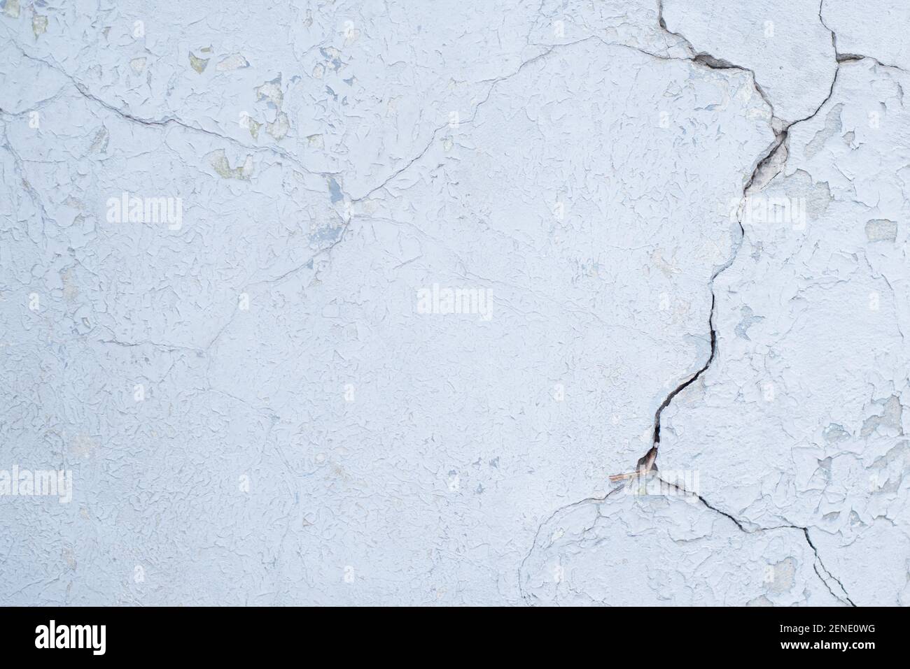 Blue board with cracks from paint. Old wall background. Stock Photo