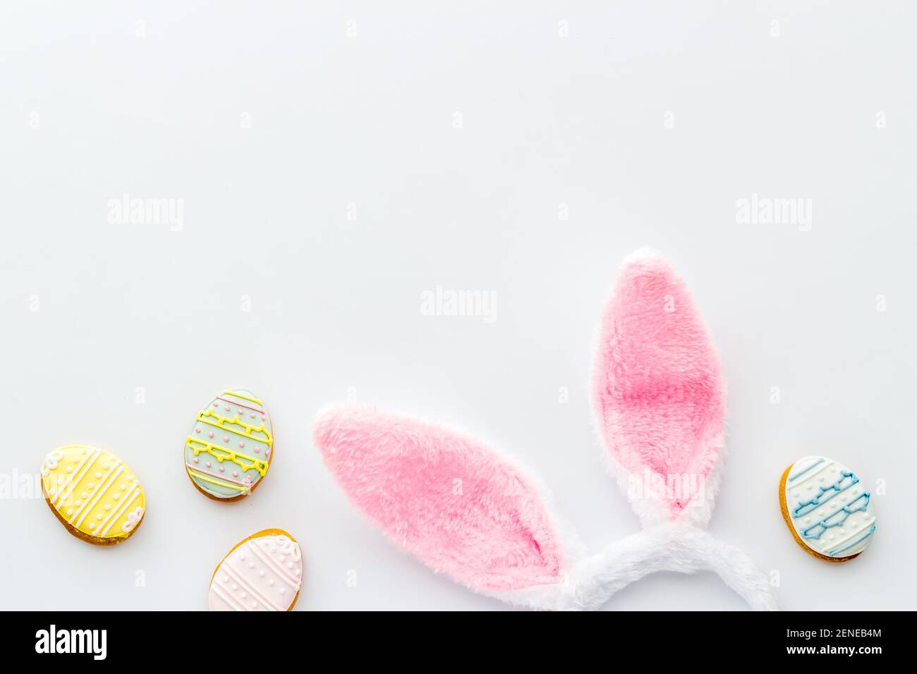 Happy Easter background. Bunny ears with eggs cookies, space for text ...