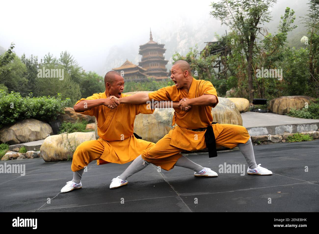 Henan,CHINA-Shaolin boys practice kung fu in the sweltering heat during the  zen shaolin music ceremony at a shaolin temple in dengfeng, henan province,  Aug. 4, 2019.These shaolin unique skills include: shaolin arhat