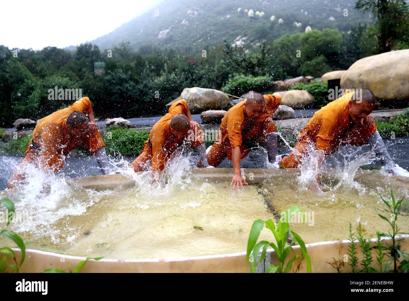 Henan,CHINAShaolin boys practice kung fu in the sweltering heat during