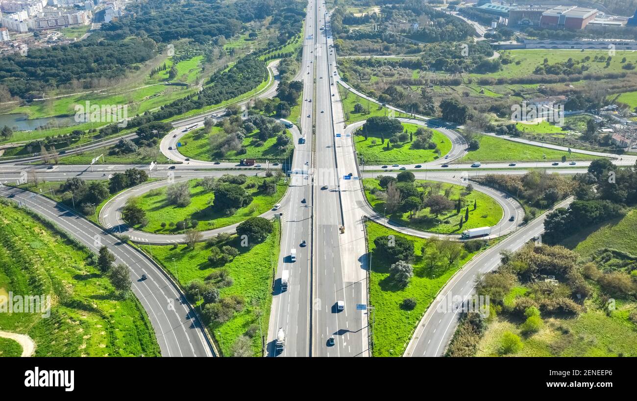 Drone view of cloverleaf interchange. Highway road junction. Portugal, Almada Stock Photo