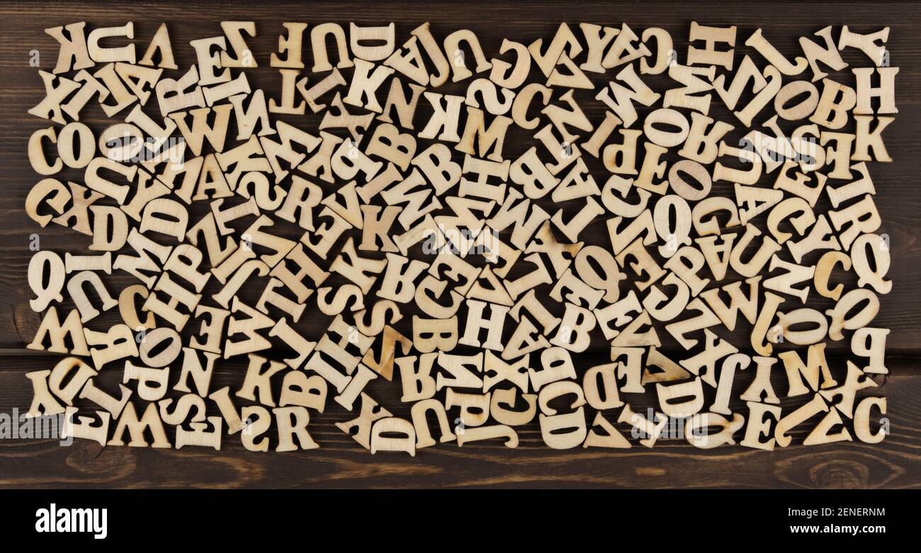 background is made of wooden jumbled letters. english alphabet. vintage letterpress types. English Language Day Stock Photo