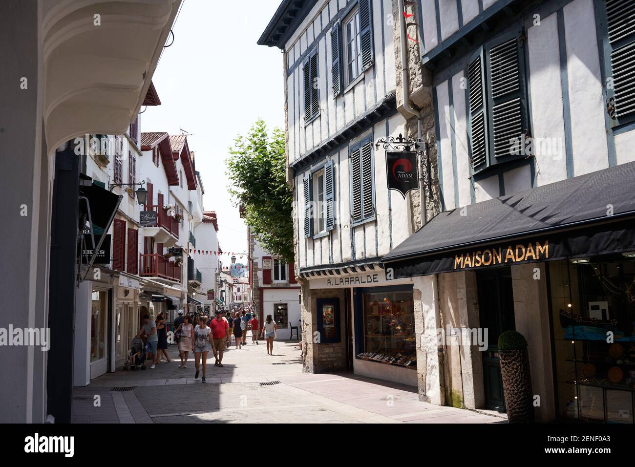 Saint Jean de Luz, France - July 22, 2019 - shopping in the narrow streets.Afternoon shopping in a beautiful small seaside resort  from fashion bouti Stock Photo