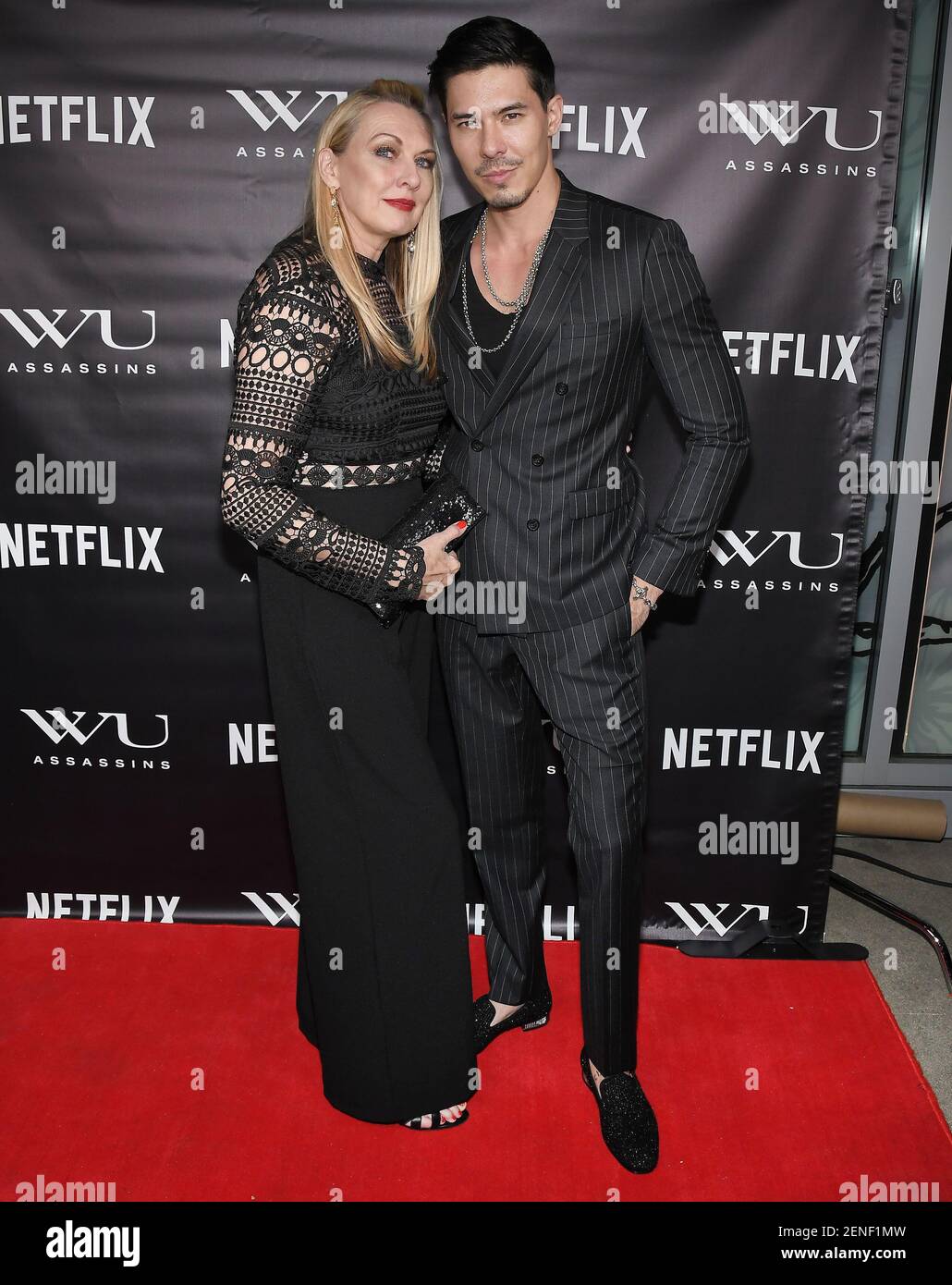 (LR) Joanne Cassidy and Son Lewis Tan at Netflix's WU ASSASSINS Premiere Party held at the