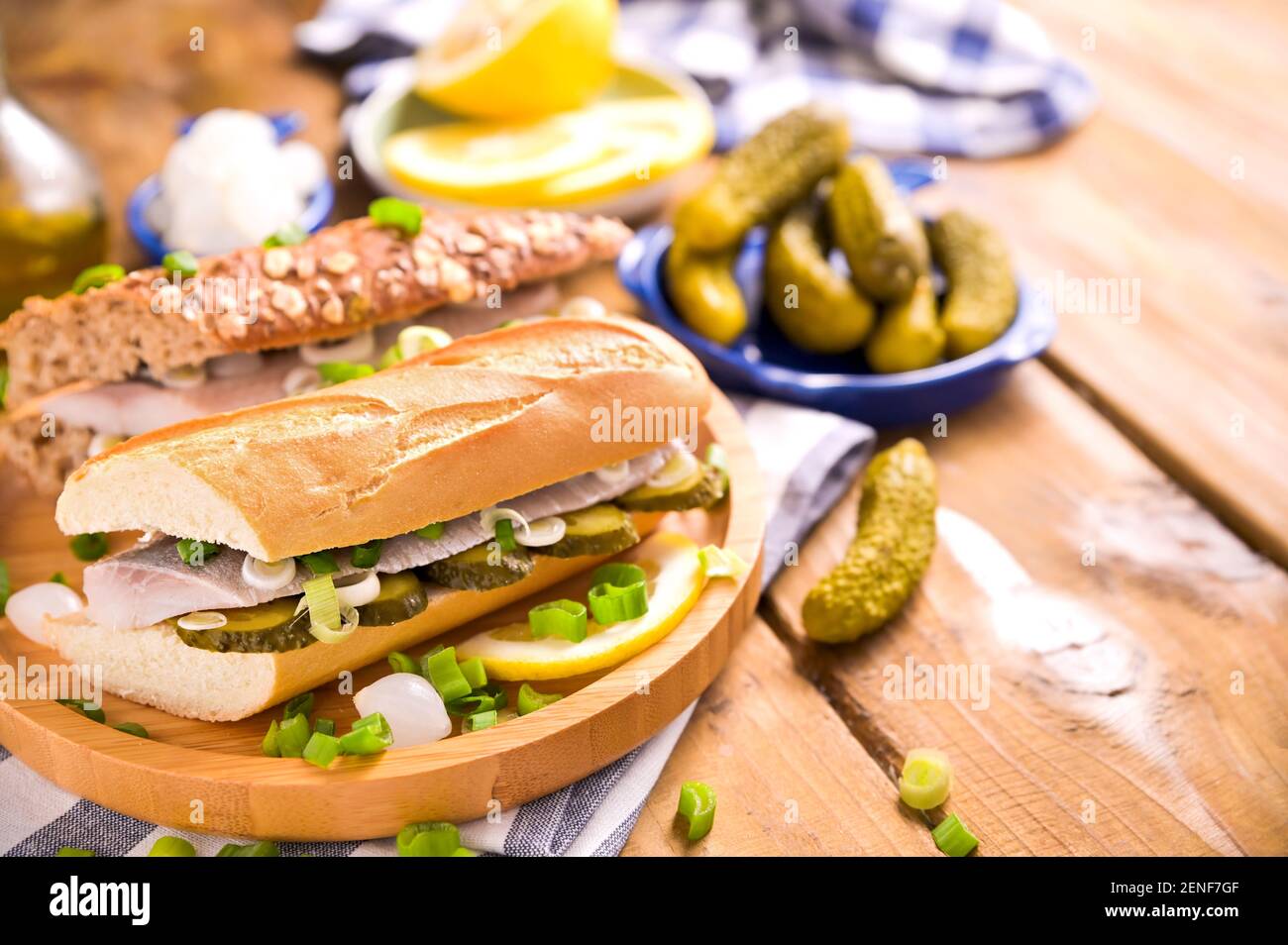 Dutch herring in a sandwich. Toast with Dutch herring, onions, pickles