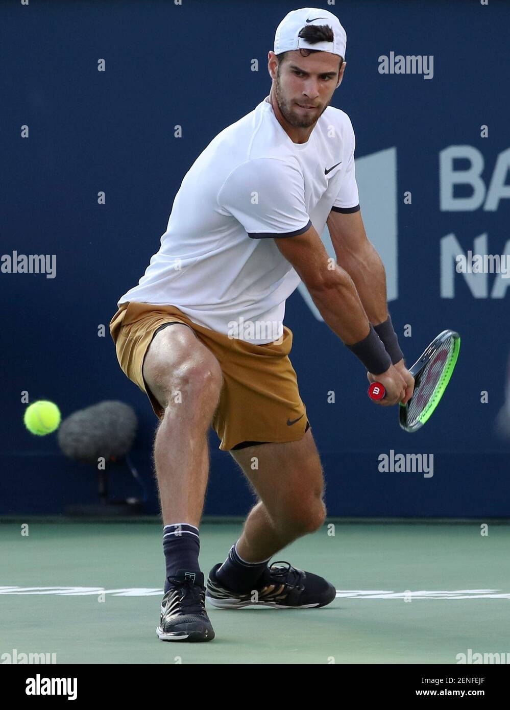 Aug 10, 2019; Montreal, Quebec, Canada; Karen Khachanov from Russia hits a  shot against Daniil Medvedev from Russia (not pictured) during the Rogers  Cup tennis tournament at Stade IGA. Mandatory Credit: Jean-Yves