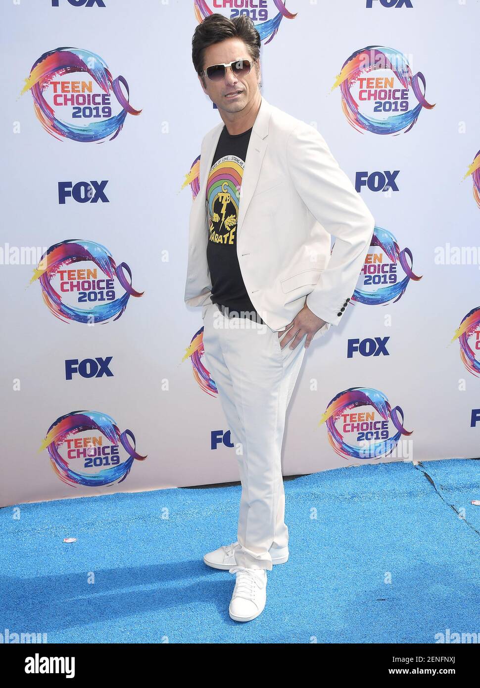 John Stamos arrives at the Teen Choice Awards 2019 held at the Hermosa