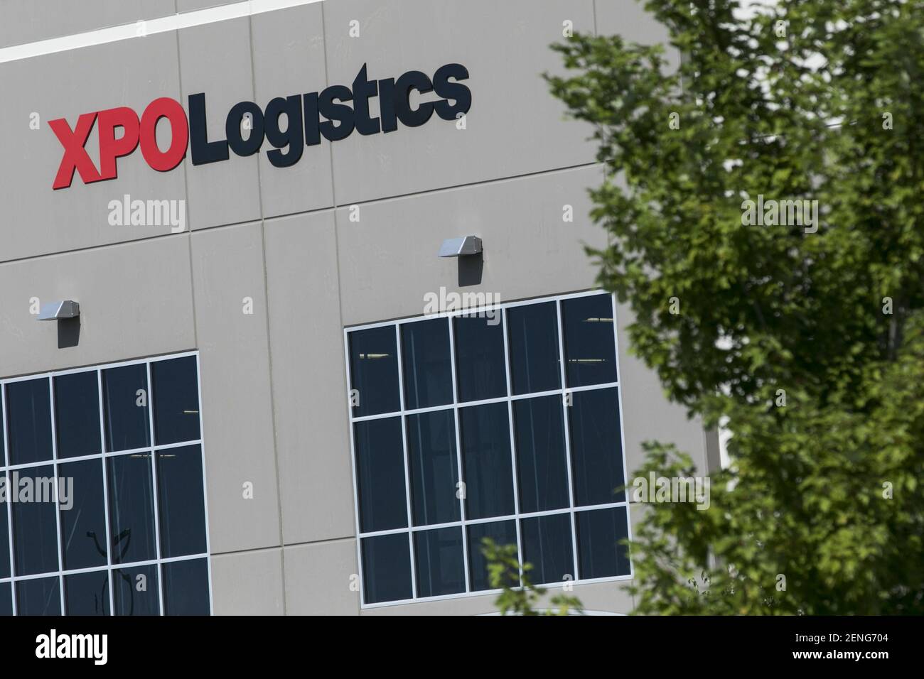 A logo sign outside of a facility occupied by XPO Logistics, Inc., in