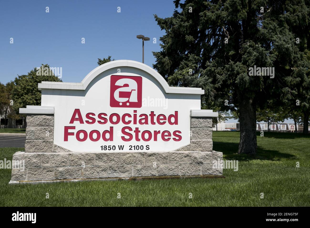 A logo sign outside of the headquarters of Associated Food Stores in