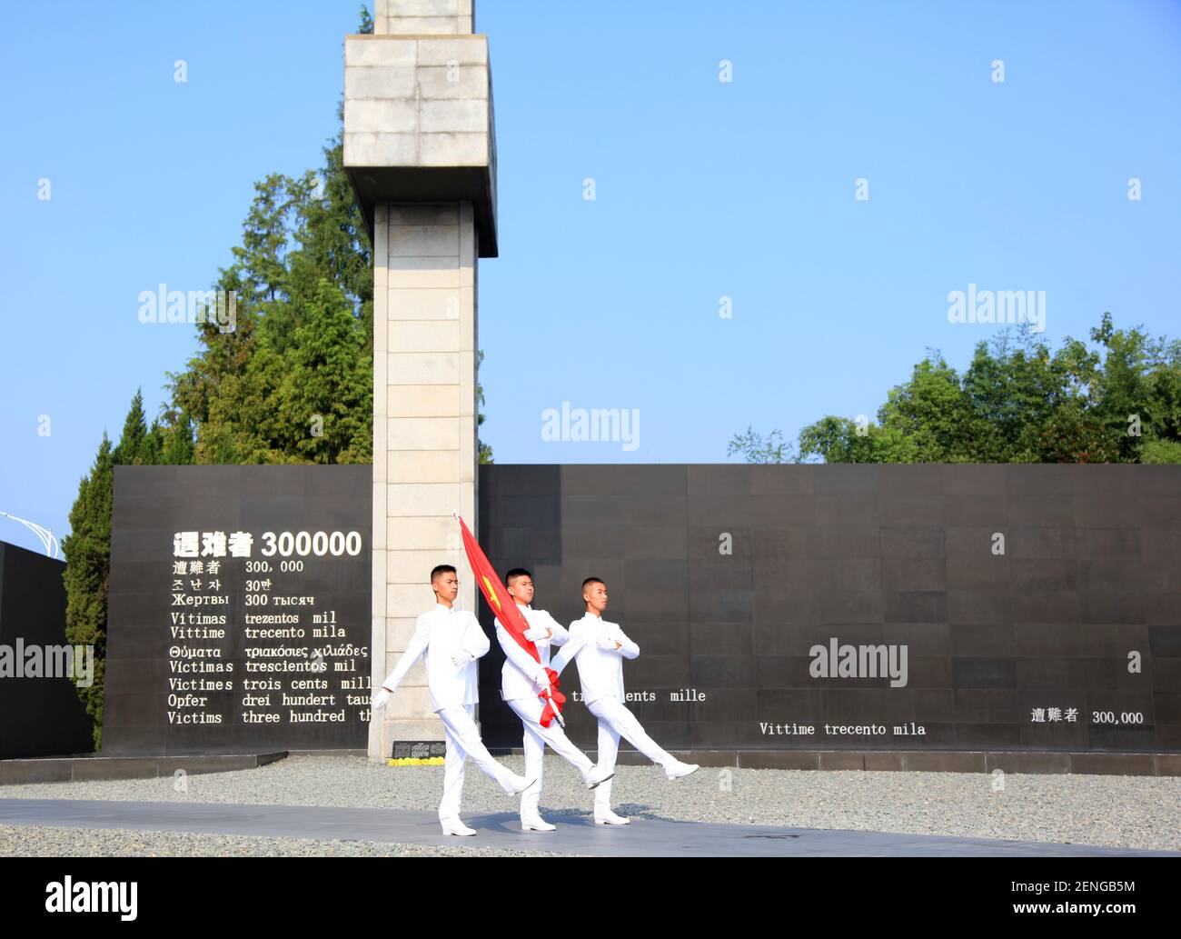 Representatives march during a flagraising ceremony to commemorate the