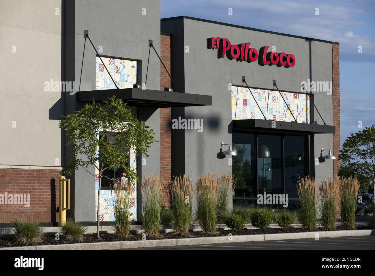 A logo sign outside of a El Pollo Loco fast food restaurant location in