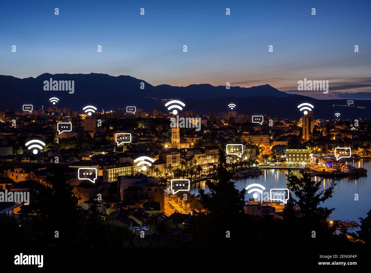 View of Split's historic Old Town and beyond from above in Croatia at dusk. Wireless network connection, WiFi, smart city and online messaging concept Stock Photo