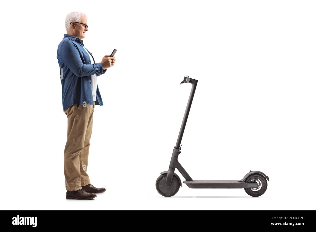 Full length profile shot of a mature man renting an electric scooter through a mobile phone application isolated on white background Stock Photo