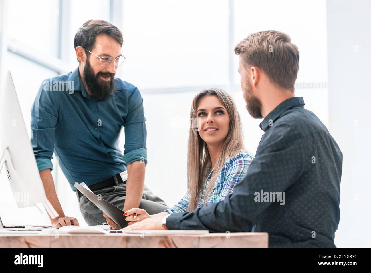 colleagues extending their hands to each other for a handshake Stock Photo