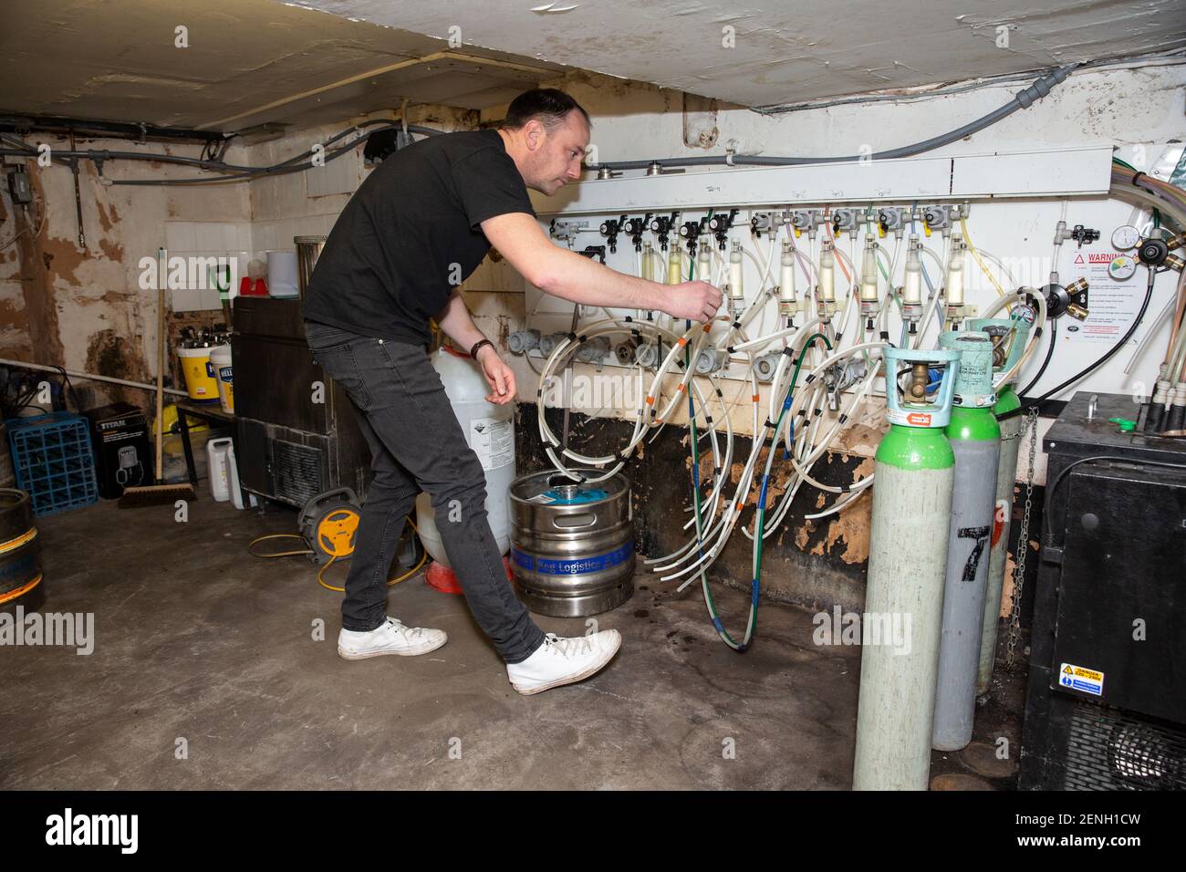 Sean Hughes landlord of 'Dylans' pub in St Albans prepares casks of beer for reopening his pub after the coronavirus lockdown#3 is lifted in England. Stock Photo