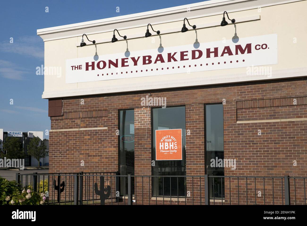 Ham Store A logo sign outside of a The Honey Baked Ham Company retail store ...