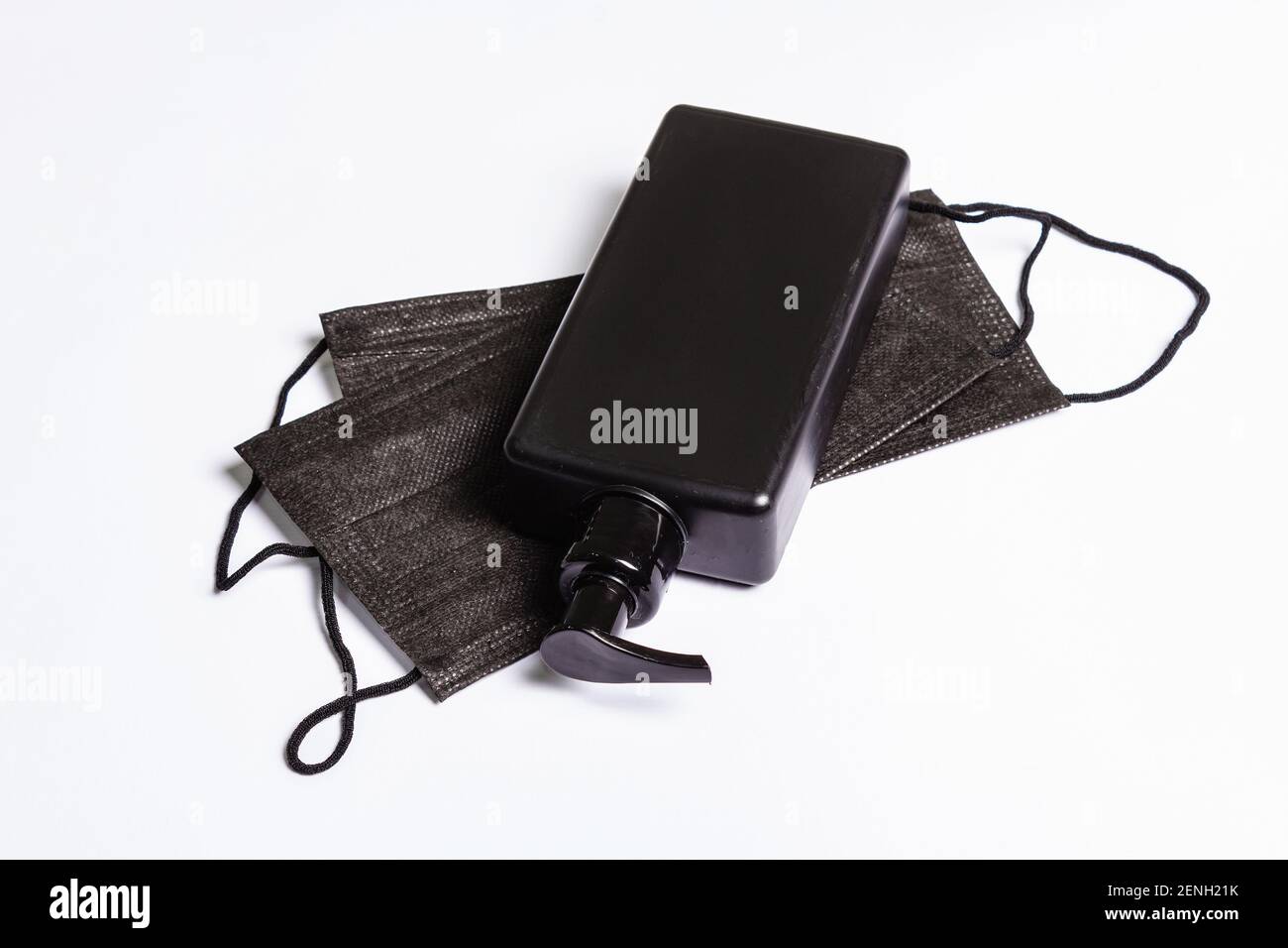 Surgical protective black masks and antiseptic isolated on white