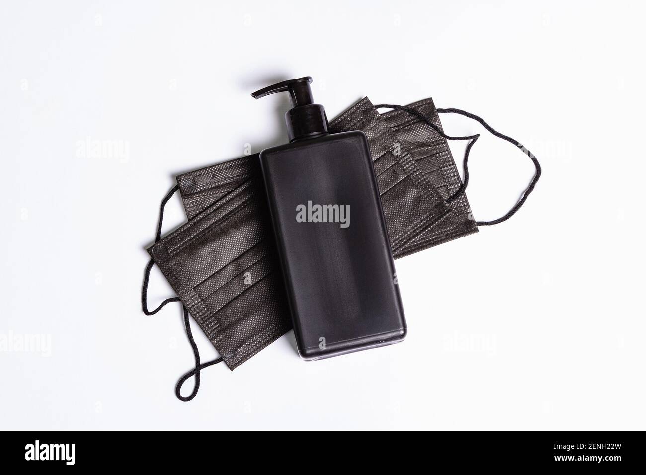 Surgical protective black masks and antiseptic isolated on white