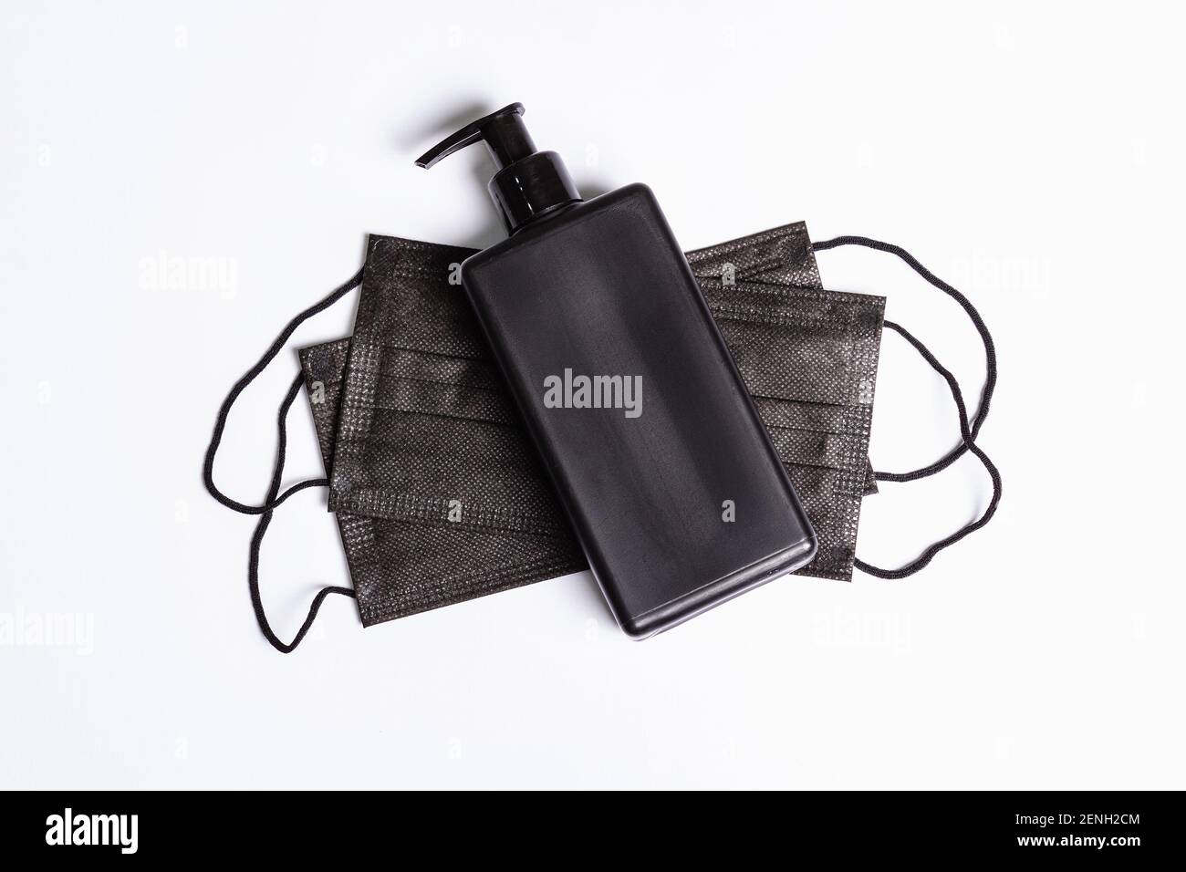 Surgical protective black masks and antiseptic isolated on white