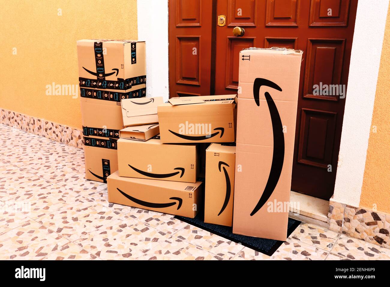 AMAZON Cardboard Boxes delivered at home to the front door Stock Photo