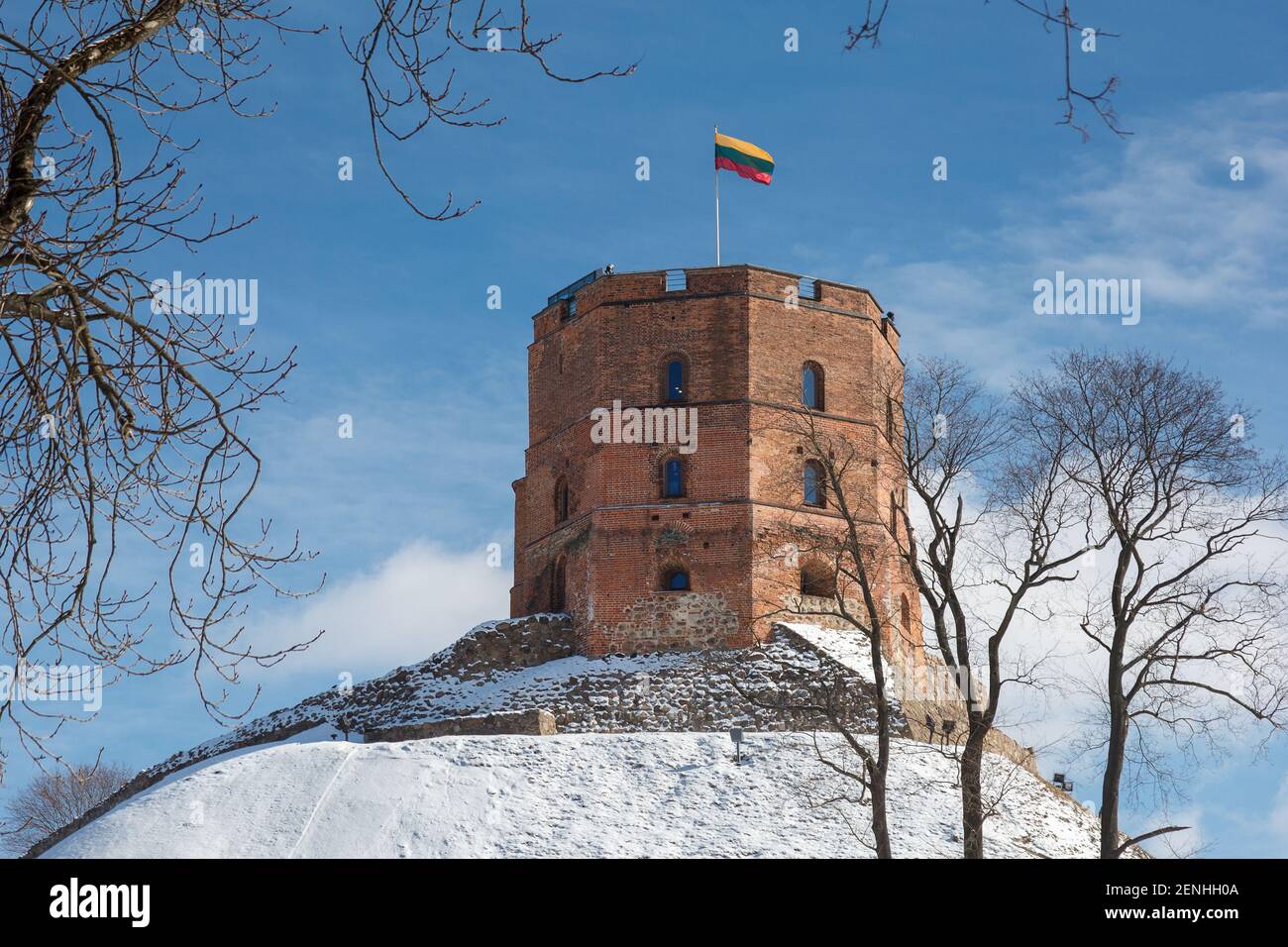 Gediminas Tower is the remaining part of the Upper Castle in Vilnius, Lithuania with Lithuanian flag in winter day Stock Photo