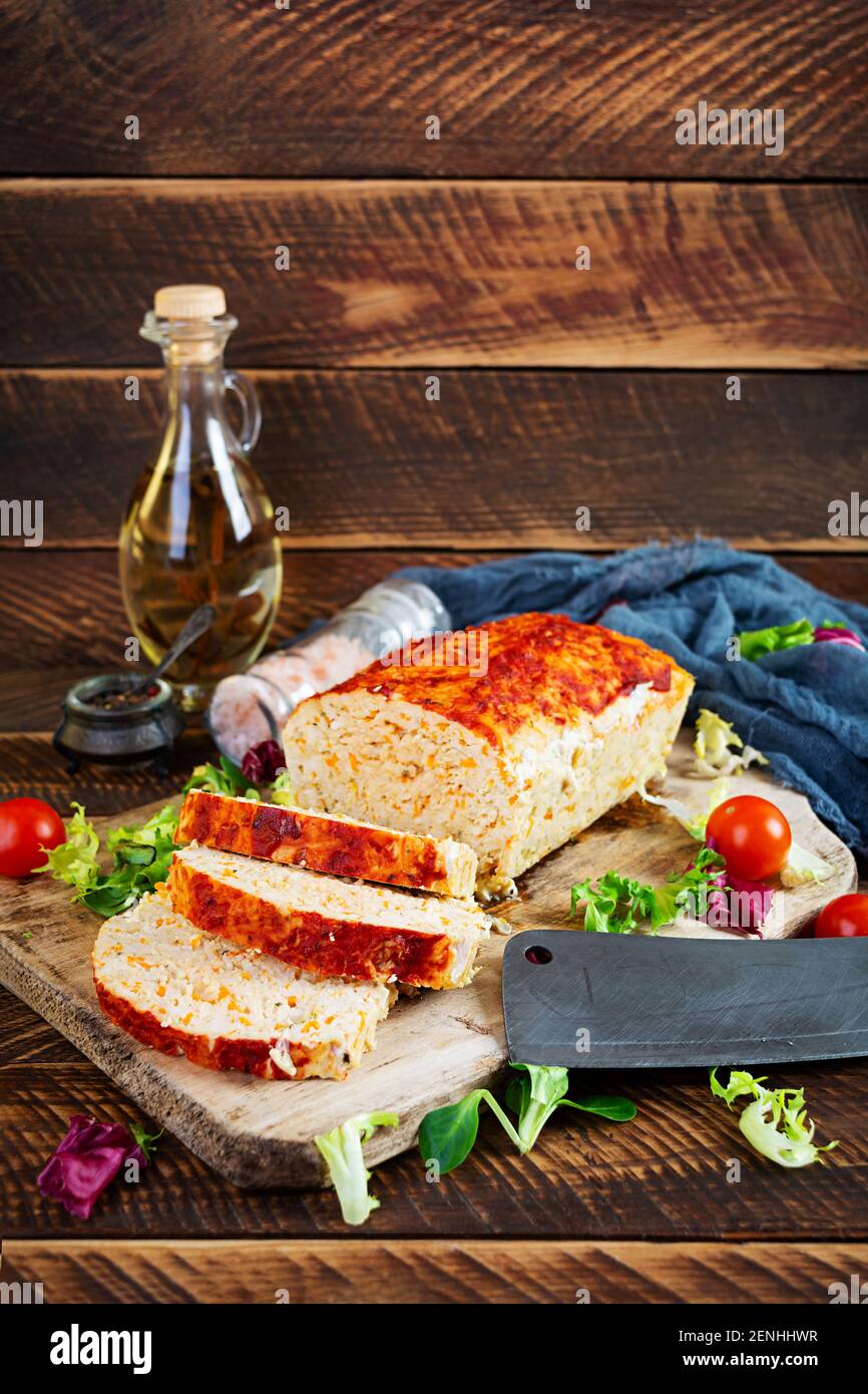 American meatloaf with chicken meat, pumpkin and green peas. Baked minced chicken meat Stock Photo