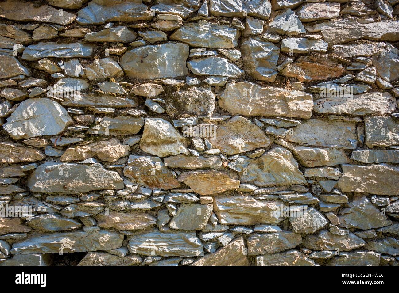 Dry old rock wall under the sun light, background, wallpaper, detailed