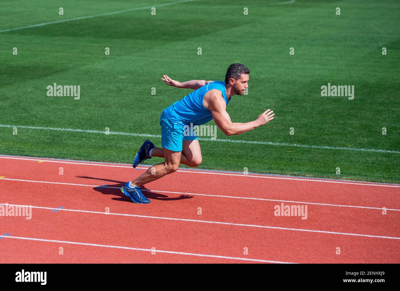 Runner at finish. Athlete runner prepare to race at stadium. Running