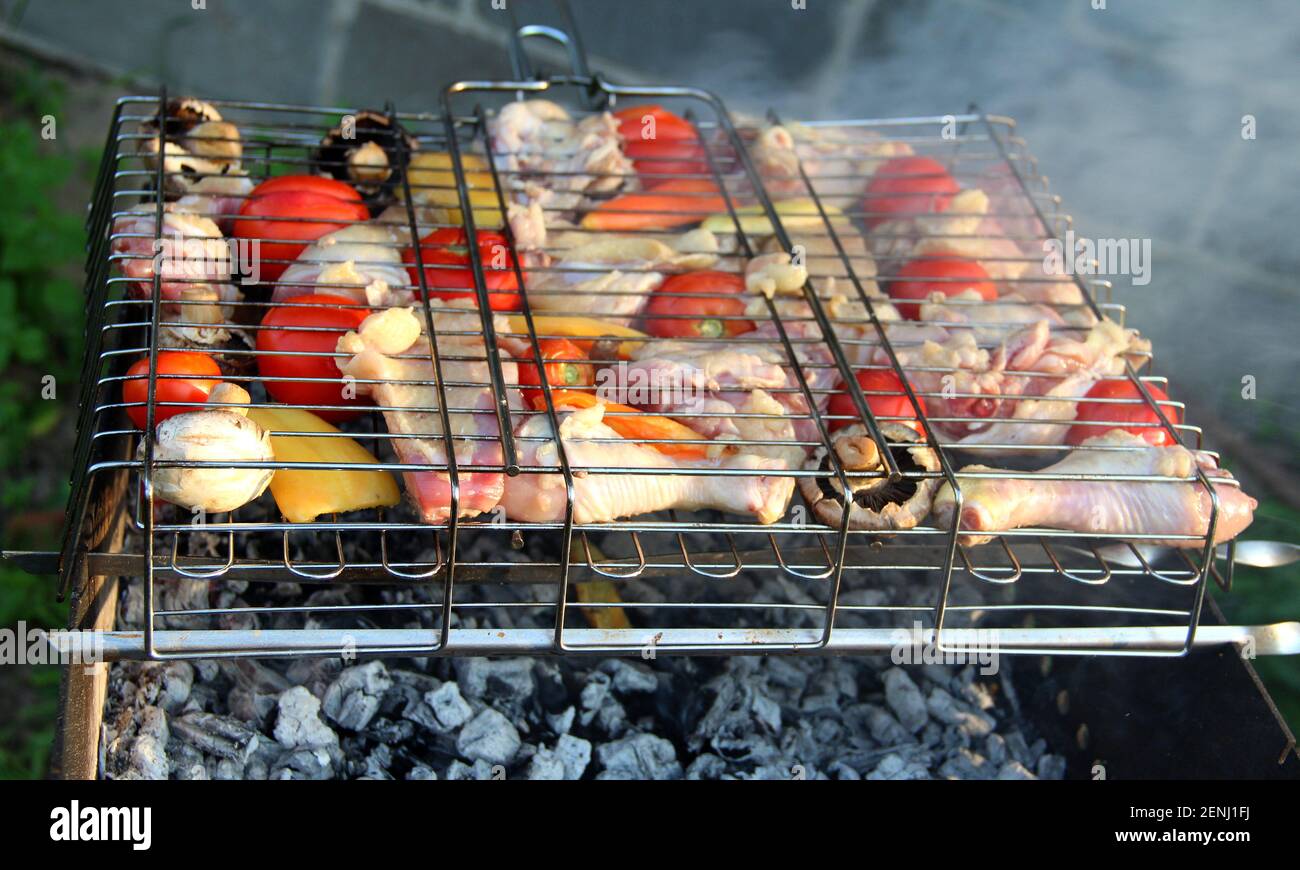 Meat And Veggies Over Heat Coals In BBQ Grill Stock Photo Alamy