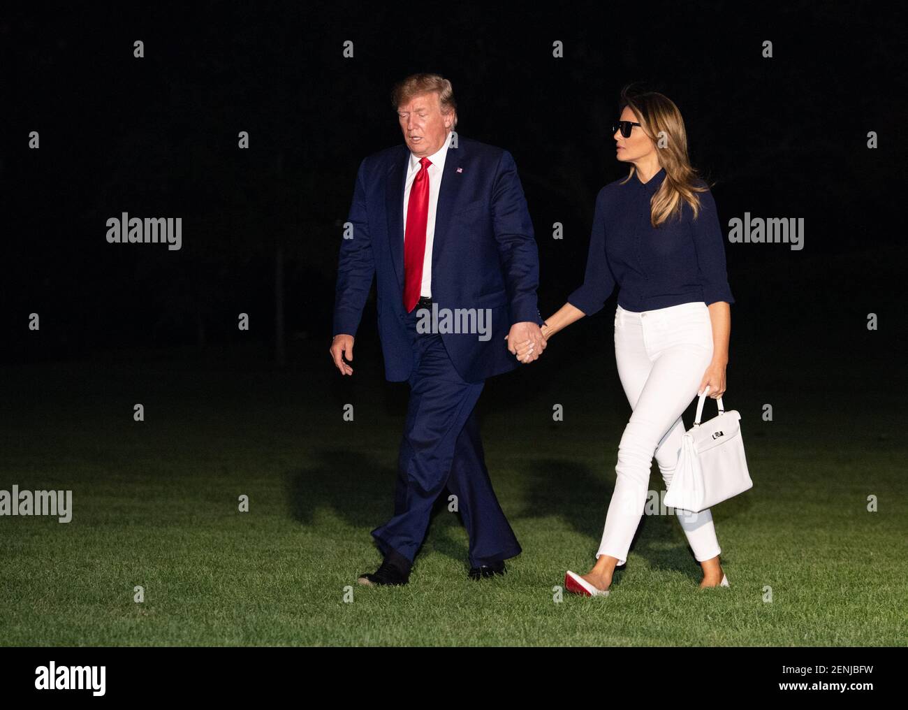 President Donald Trump and First Lady Melania Trump return to the White ...